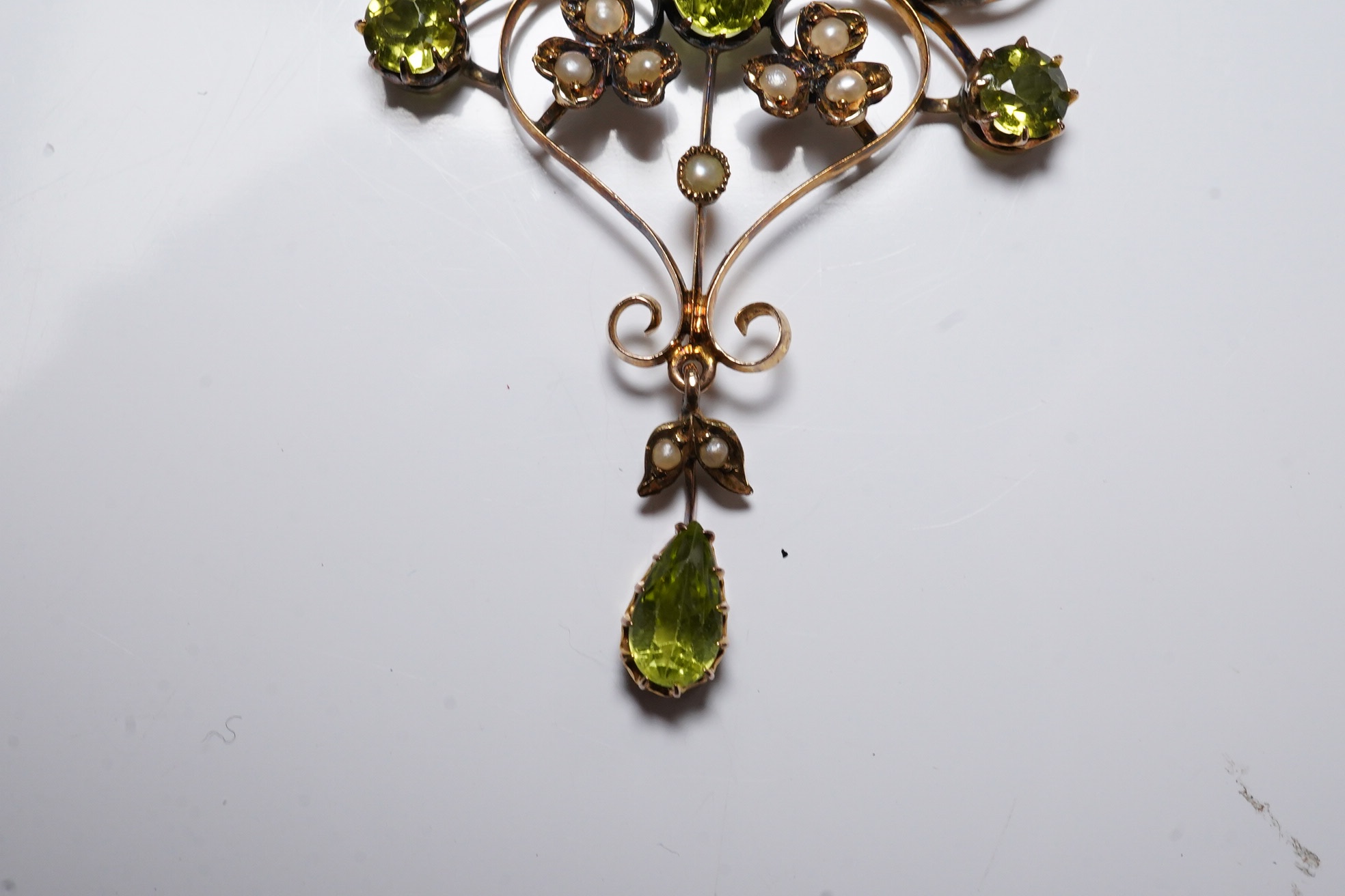 A late Victorian 9ct, peridot and seed pearl cluster set drop pendant necklace, 50cm, gross weight 5.7 grams. Condition - fair to good